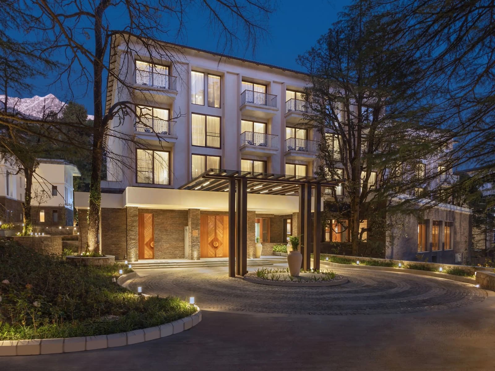 The Hyatt Regency Dharamshala with the Himalayan peaks behind it
